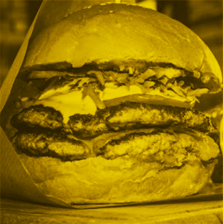 Juicy burger with lettuce, tomato, and melted cheese